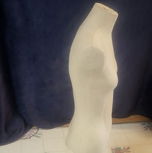 A 1/2 woman's  mannequin by Barr displays